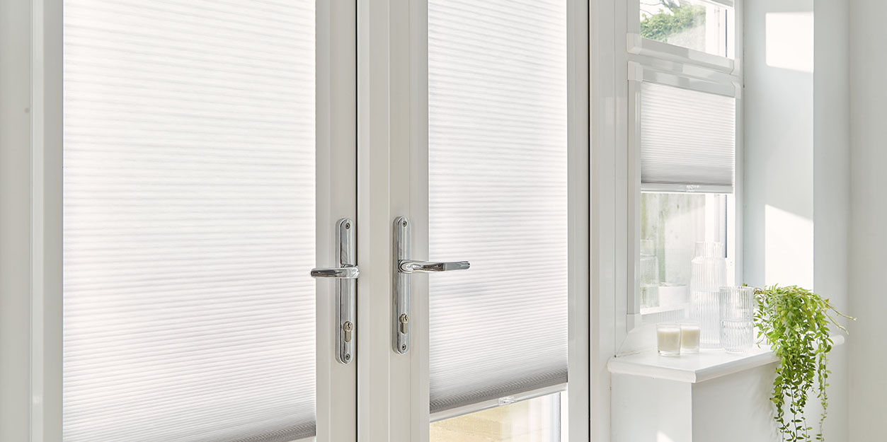 https://blinds4lesslondon.co.uk/wp-content/uploads/2026/01/pleated-blinds-for-patio-doors-Blinds4Less-London.jpg