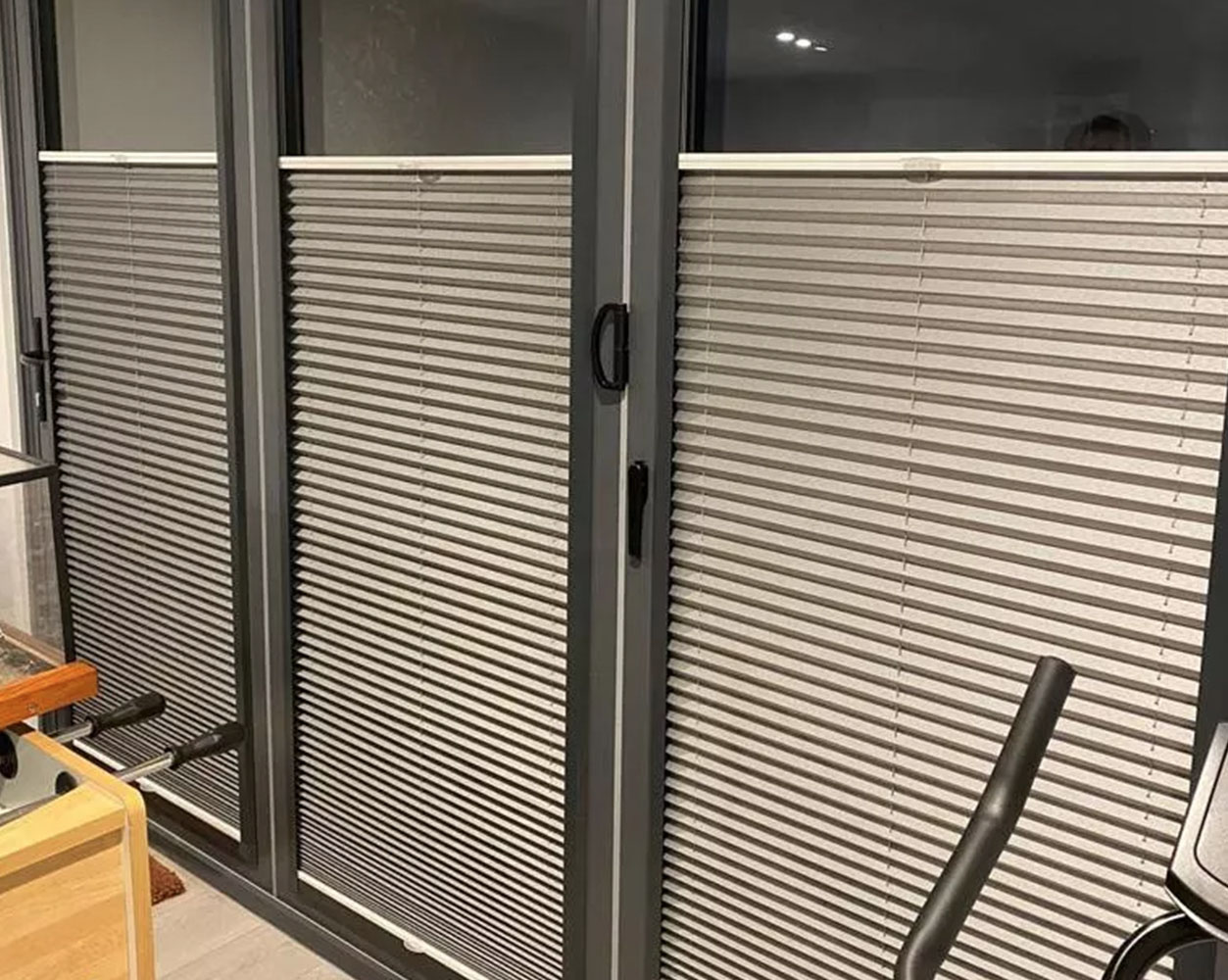https://blinds4lesslondon.co.uk/wp-content/uploads/2026/01/pleated-blinds-for-the-gym-Blinds4Less-London.jpg